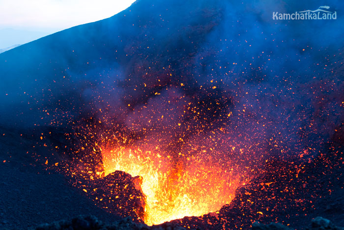 Lava splashes in the twilight.