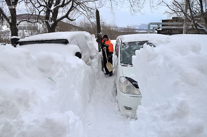 Snowdrifts in front of the house